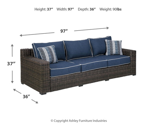 Grasson - Brown / Blue - Sofa With Cushion - Premium Sofas from Ashley Furniture - Just $1543.13! Shop now at brett interiors