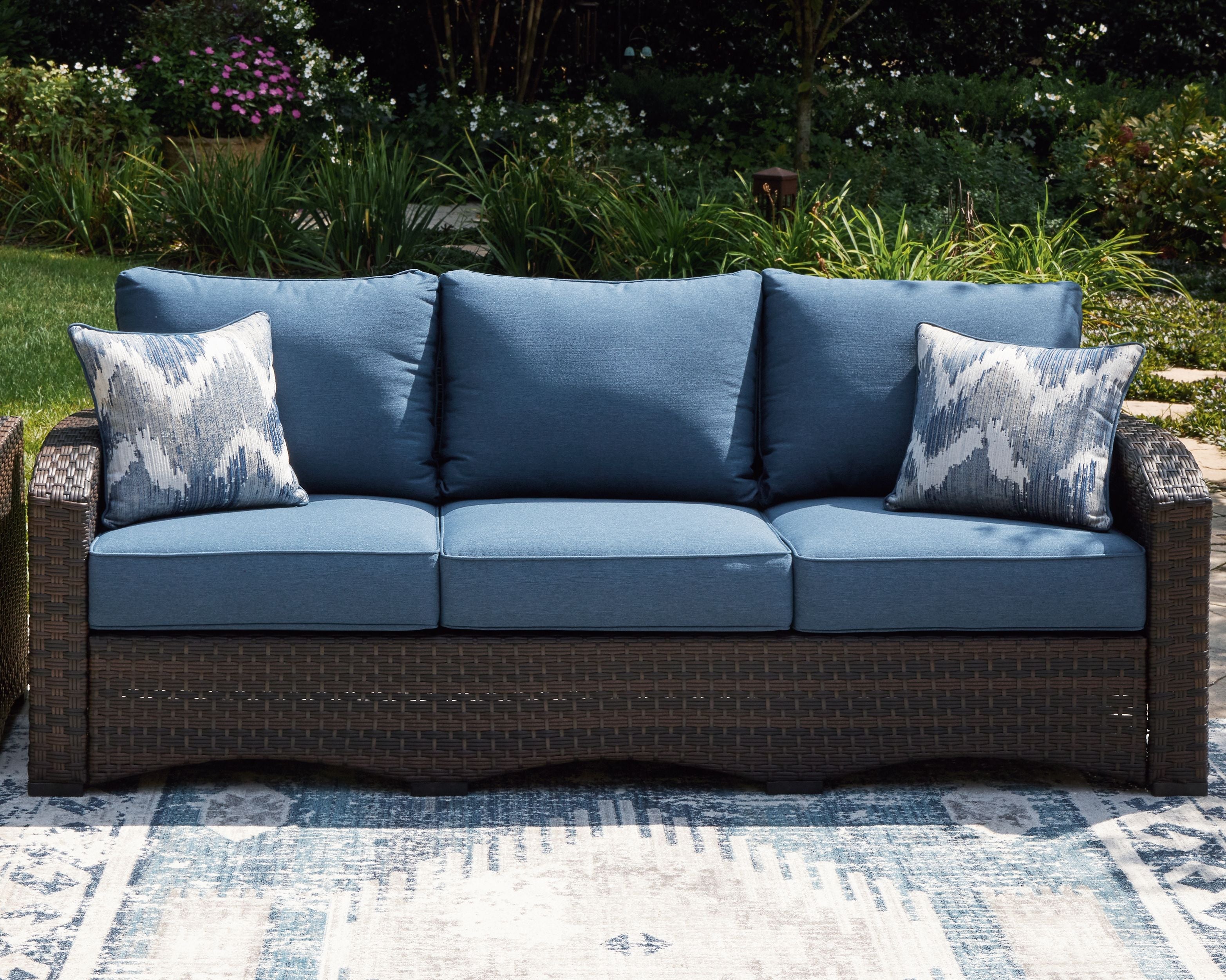 Windglow - Blue / Brown - Sofa With Cushion - Premium Sofas from Signature Design by Ashley® - Just $1130.63! Shop now at brett interiors